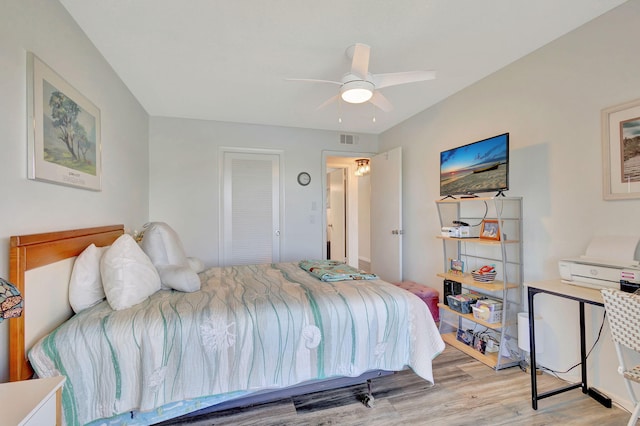 bedroom with light wood-type flooring and ceiling fan