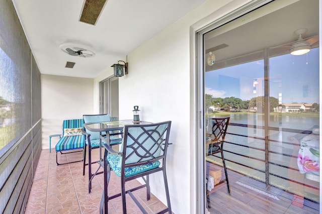 balcony featuring a water view