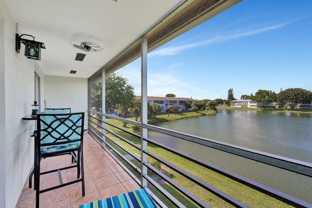 balcony featuring a water view