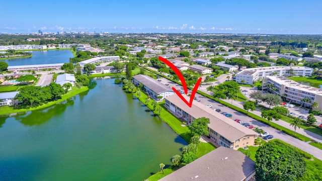 birds eye view of property with a water view