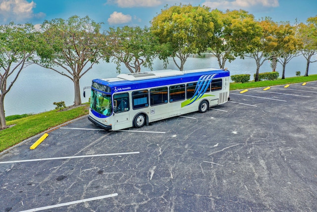 view of vehicle parking with a water view