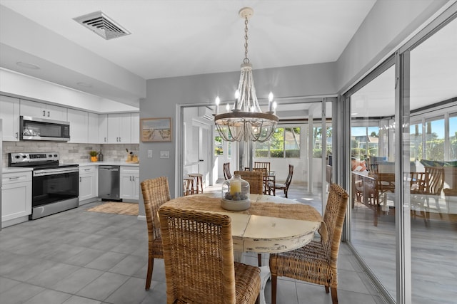 dining room featuring a chandelier