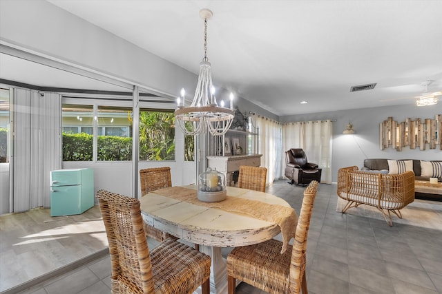 dining area featuring a notable chandelier