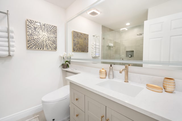 bathroom with vanity, an enclosed shower, and toilet