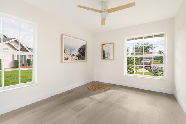 unfurnished room with light hardwood / wood-style flooring and ceiling fan