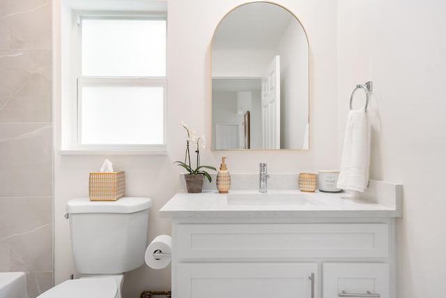 bathroom with vanity and toilet