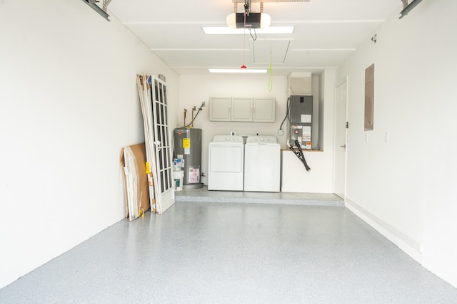 garage featuring washing machine and dryer, water heater, heating unit, electric panel, and a garage door opener