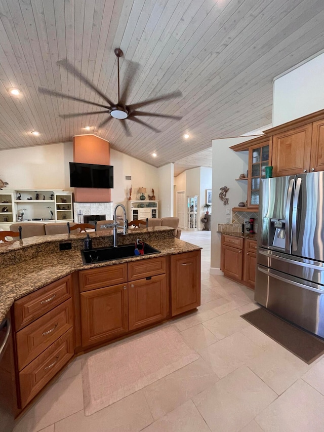 kitchen featuring sink, stainless steel appliances, vaulted ceiling, and wooden ceiling