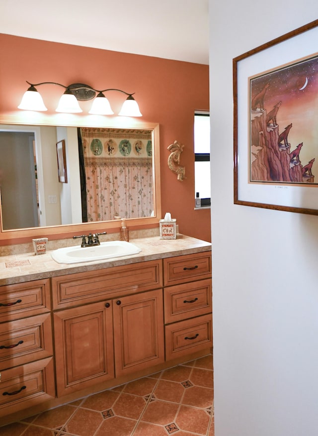 bathroom with tile patterned flooring and vanity