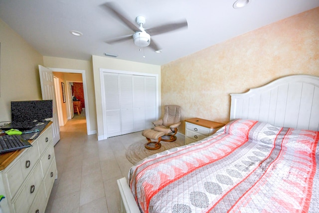 bedroom with ceiling fan and a closet