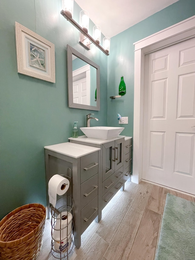 bathroom with wood-type flooring and vanity