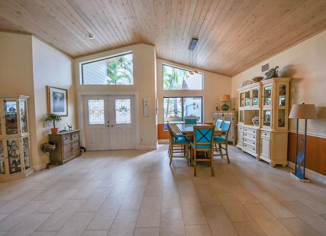 tiled dining room featuring high vaulted ceiling, french doors, and wood ceiling