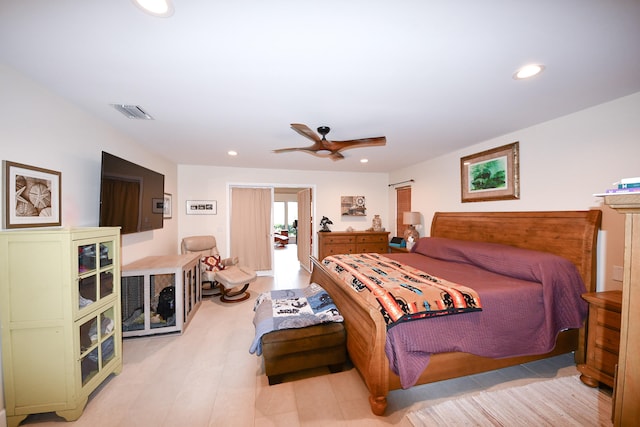 bedroom with light hardwood / wood-style floors and ceiling fan