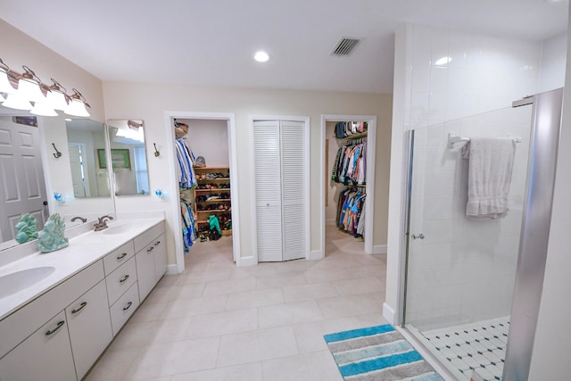 bathroom featuring vanity and a shower with shower door