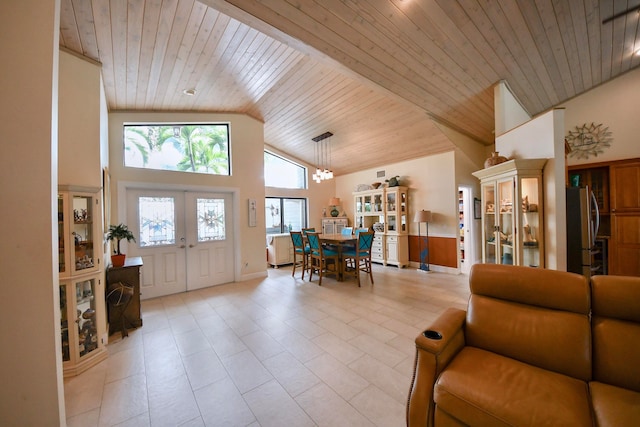 foyer entrance featuring french doors, wooden ceiling, high vaulted ceiling, and light tile patterned floors