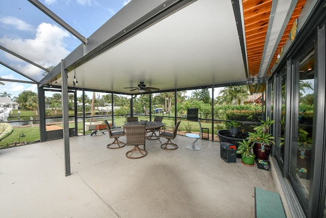 sunroom featuring ceiling fan