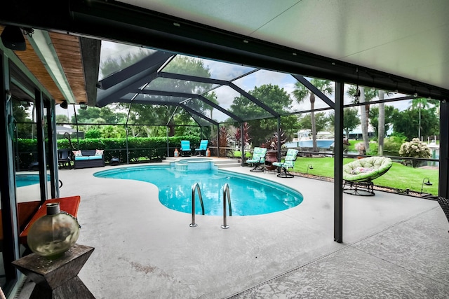 view of swimming pool with a patio and a lanai