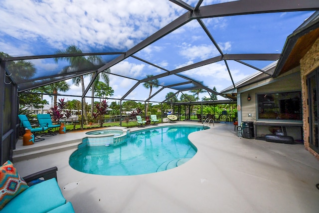 view of pool with glass enclosure, an in ground hot tub, and a patio area