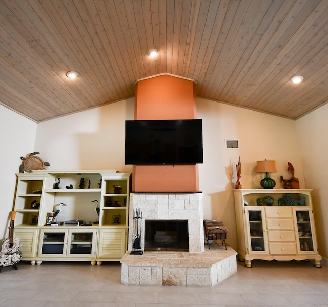 living room with light tile patterned floors, wood ceiling, vaulted ceiling, and a tile fireplace