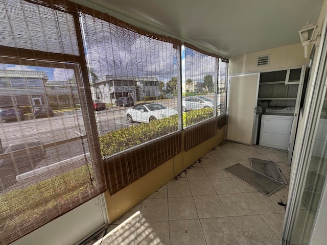 sunroom / solarium featuring washer / clothes dryer