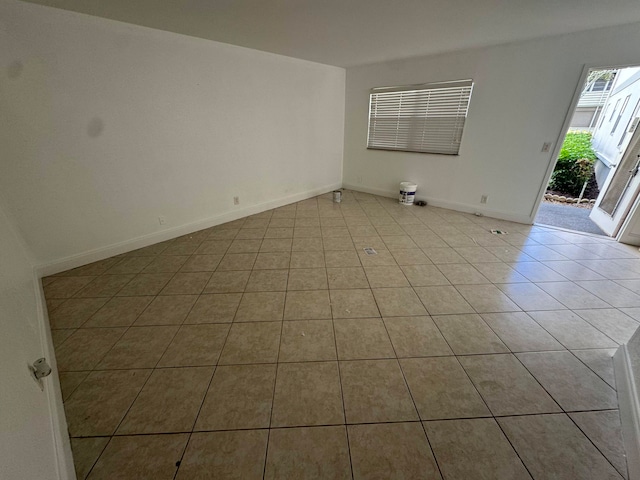 spare room with light tile patterned floors