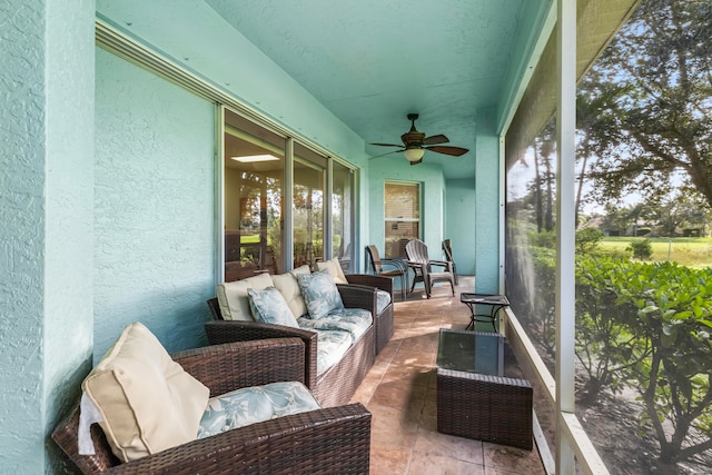 sunroom / solarium with ceiling fan