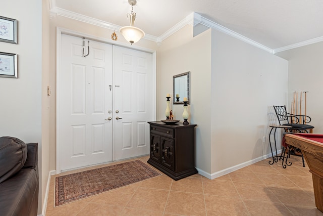 tiled foyer with ornamental molding