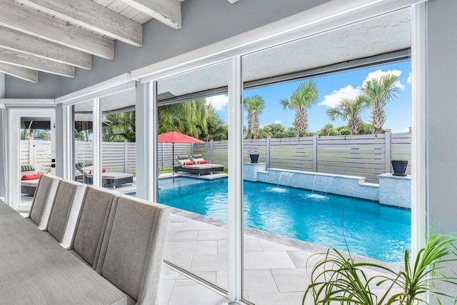 view of swimming pool featuring pool water feature