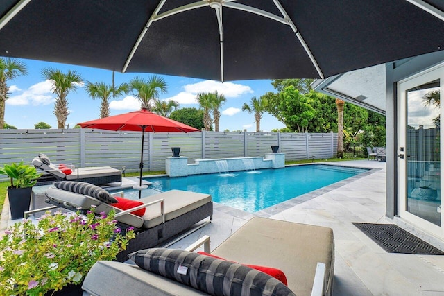 view of pool with a patio area and pool water feature