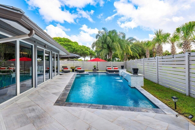 view of swimming pool featuring a patio area and pool water feature