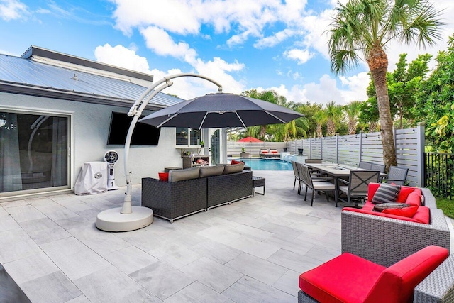 view of patio / terrace featuring an outdoor living space and a fenced in pool