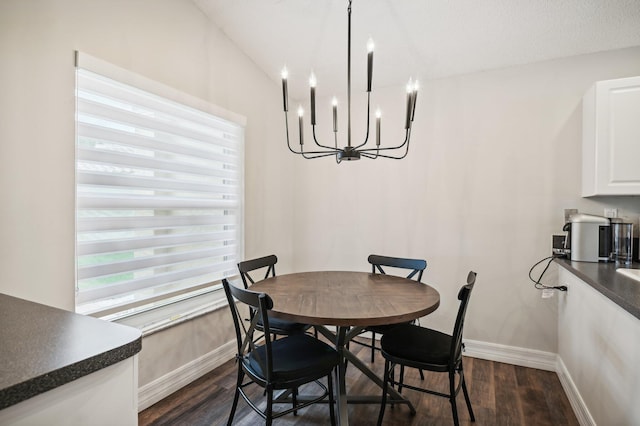 dining area with vaulted ceiling, dark hardwood / wood-style floors, and a notable chandelier