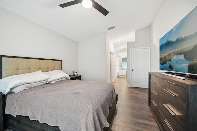 bedroom with hardwood / wood-style flooring, ceiling fan, and lofted ceiling