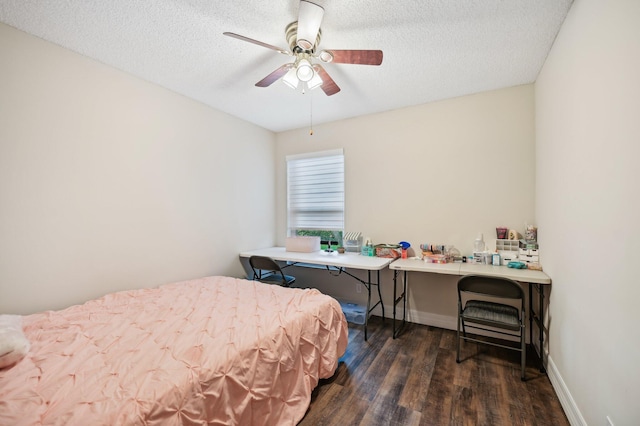 bedroom featuring a textured ceiling, ceiling fan, and dark wood-type flooring