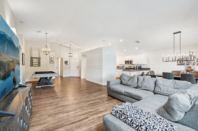 living room with lofted ceiling, wood-type flooring, and billiards