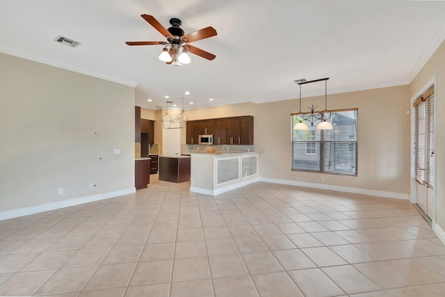 kitchen featuring backsplash, ornamental molding, light tile patterned floors, ceiling fan, and dark brown cabinetry