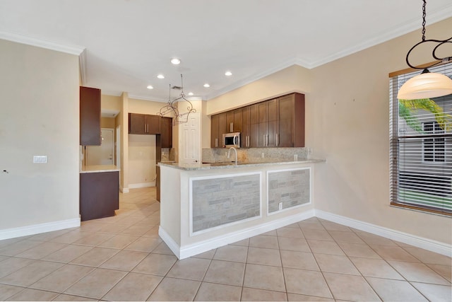 kitchen with light tile patterned flooring, sink, crown molding, kitchen peninsula, and light stone countertops