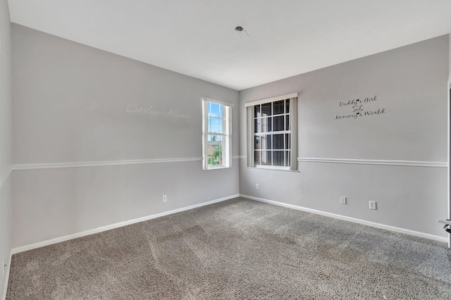 empty room with carpet flooring