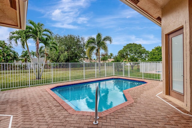 view of swimming pool with a patio area