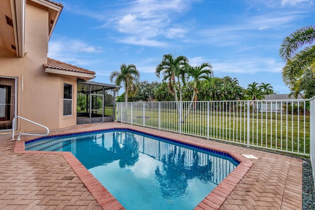 view of swimming pool featuring a patio area