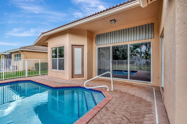 view of swimming pool featuring a patio