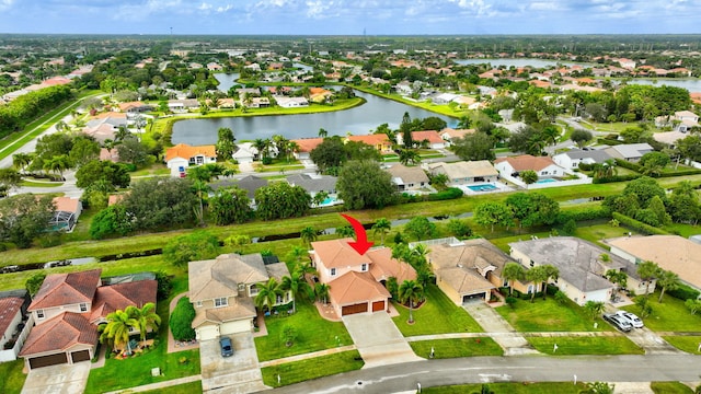 drone / aerial view with a water view