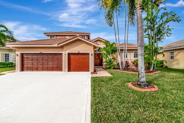 view of front of home featuring a garage and a front yard