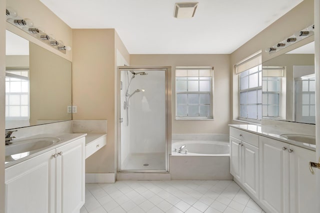1102 Oakwater Dr, Royal Palm Beach, FL 33411 - bathroom featuring a garden tub, a sink, two vanities, visible vents, and a shower stall