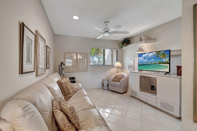 living room featuring ceiling fan and light tile patterned floors