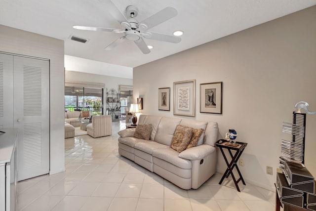 living room featuring ceiling fan and light tile patterned flooring