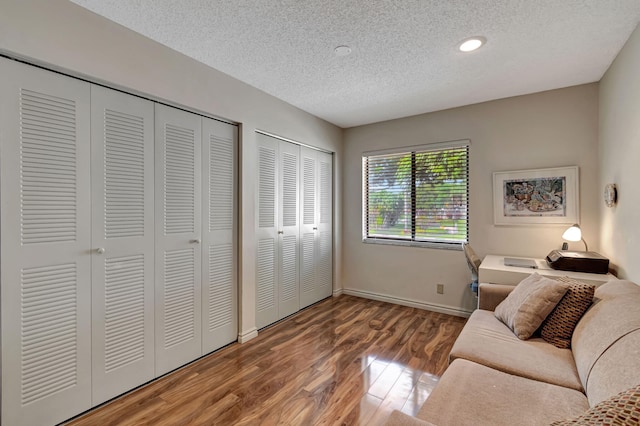 interior space with hardwood / wood-style flooring and a textured ceiling