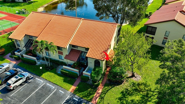 birds eye view of property featuring a water view