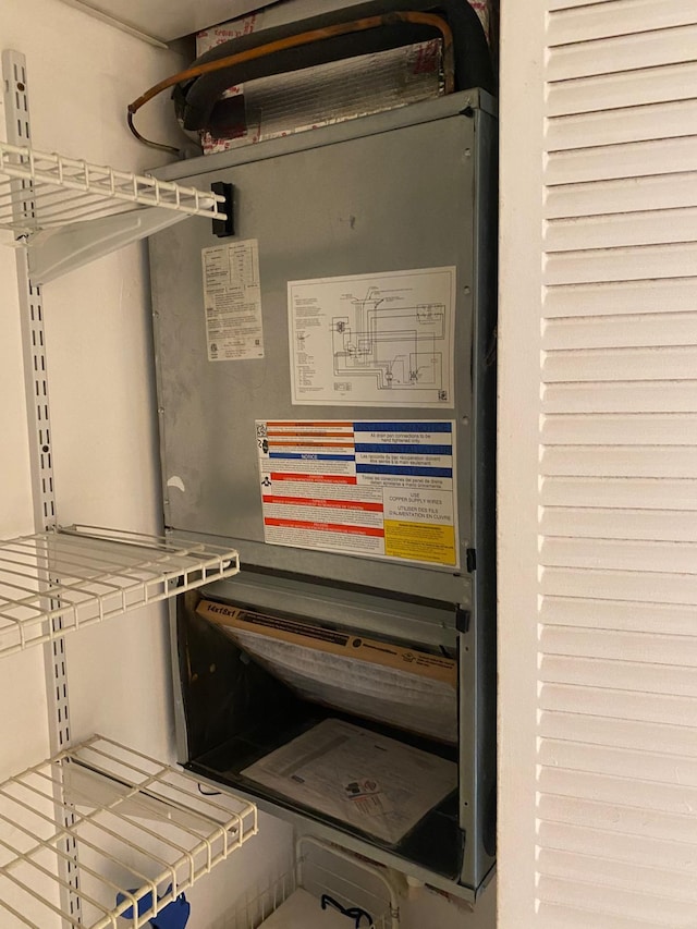 utility room with heating unit