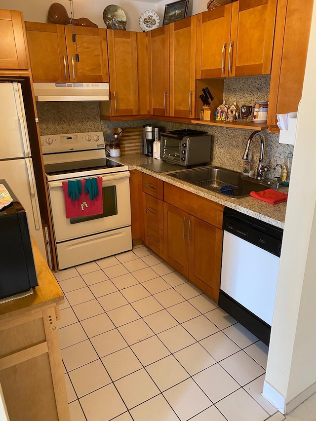 kitchen featuring white range with electric cooktop, tasteful backsplash, sink, dishwasher, and light tile patterned floors